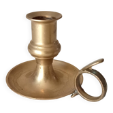 Antique hand candlestick in solid gilded brass.