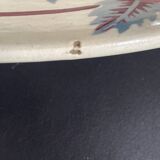 Oval plate Moulin des Loups in blue and red ceramic with a floral design.