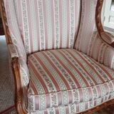 Pair of carved bergere armchairs