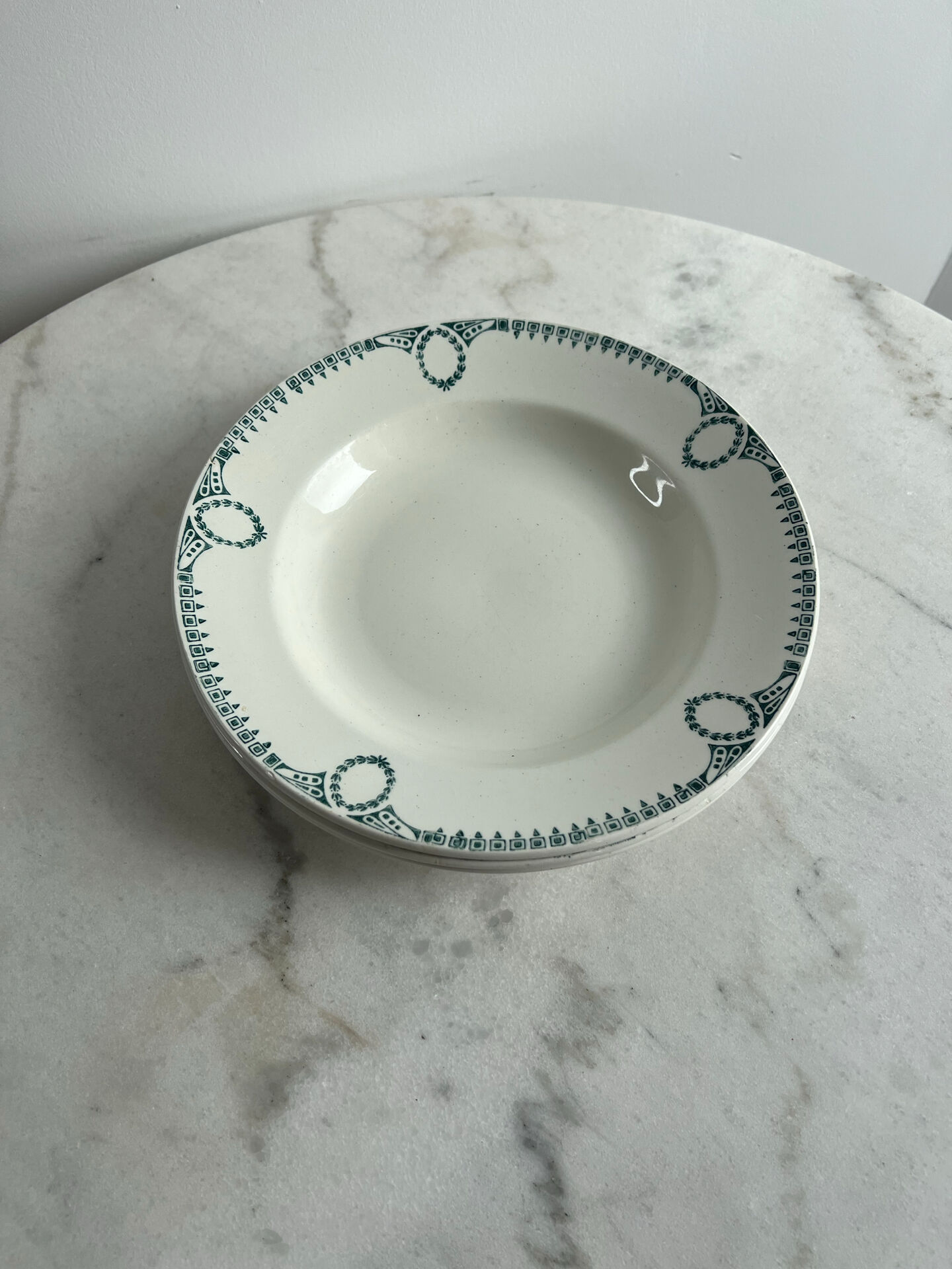 Set of 3 St Amand deep plates with green crown decoration.