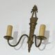 Pair of Louis XVI style bronze wall sconces with quivers and ribbons