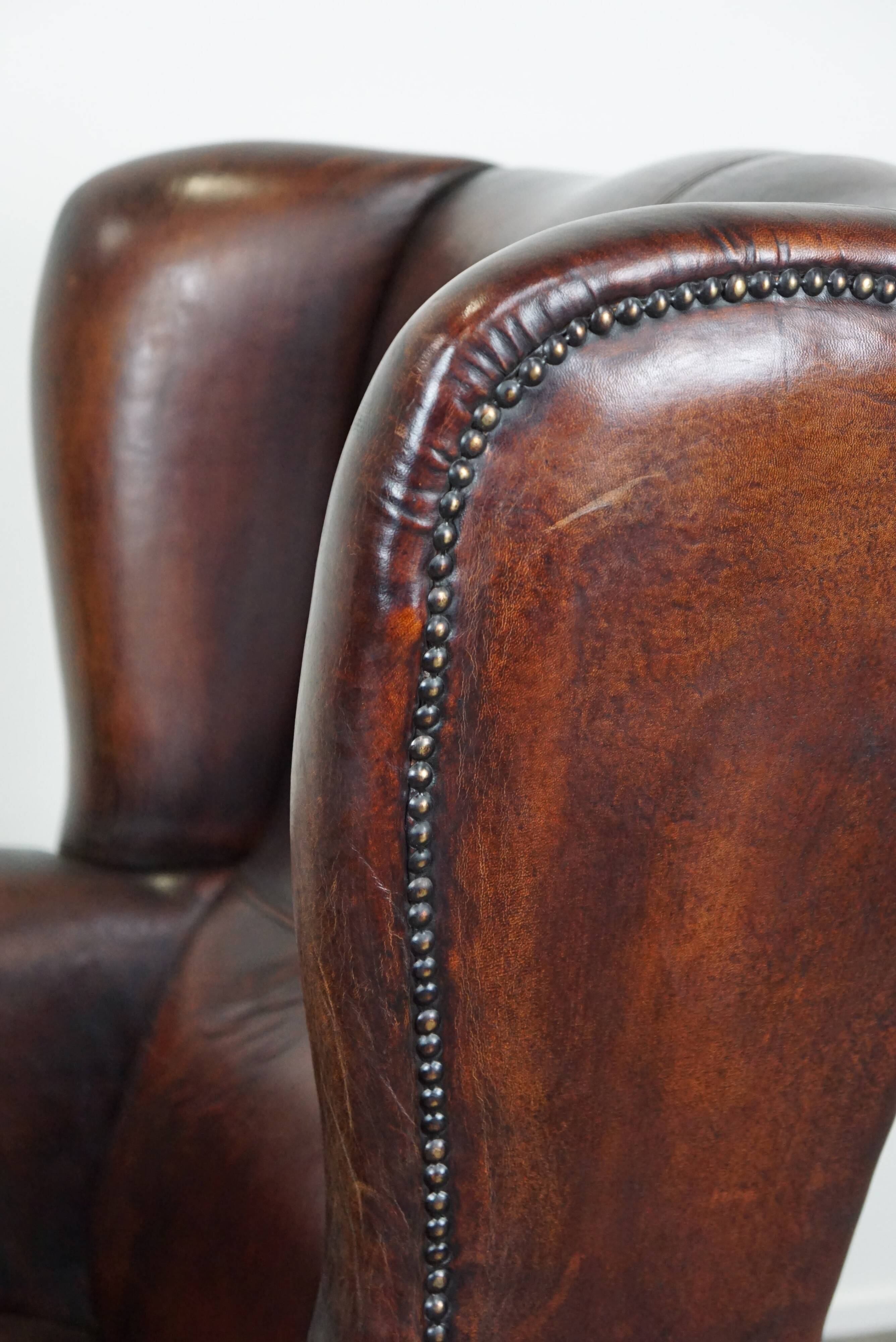 Large Sheepskin Leather Wingback Armchair with a Fixed Seat Cushion and a Stunning Patina