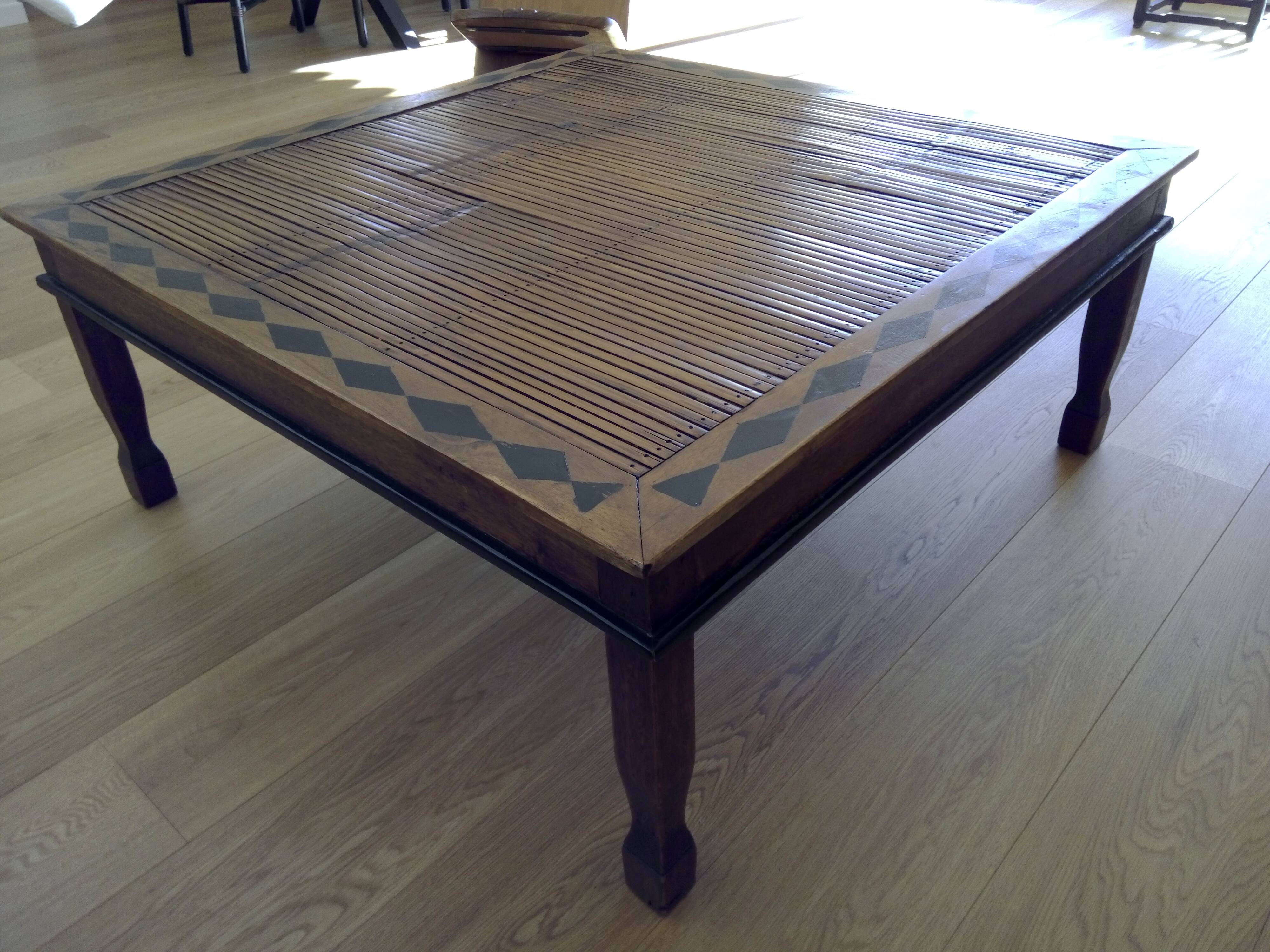 Coffee table made of exotic wood and bamboo.
