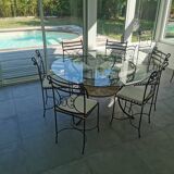 Lot table en verre et 10 chaises en fer forgé