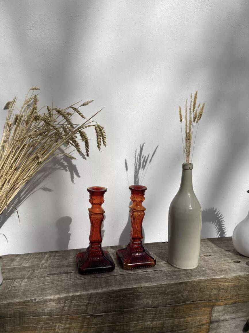 Pair of amber glass candlesticks