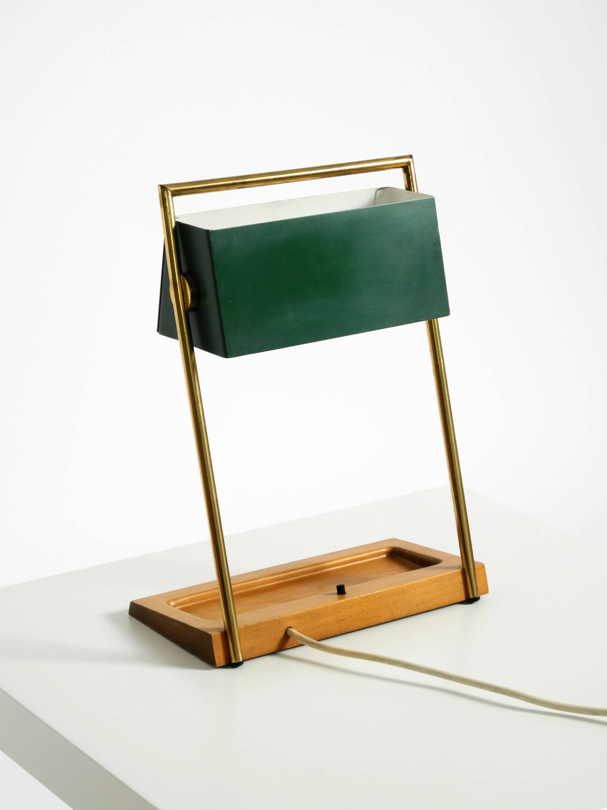 1960s Temde table lamp with a brass frame, teak base, and green lampshade