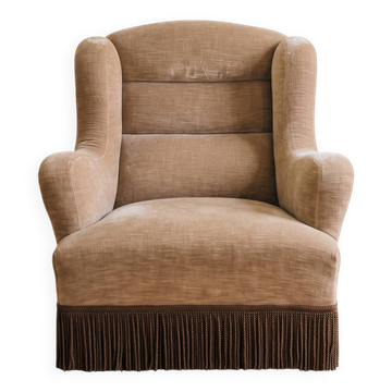 Vintage 1970s armchair in beige fabric with fringes.