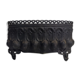 Old black iron planter