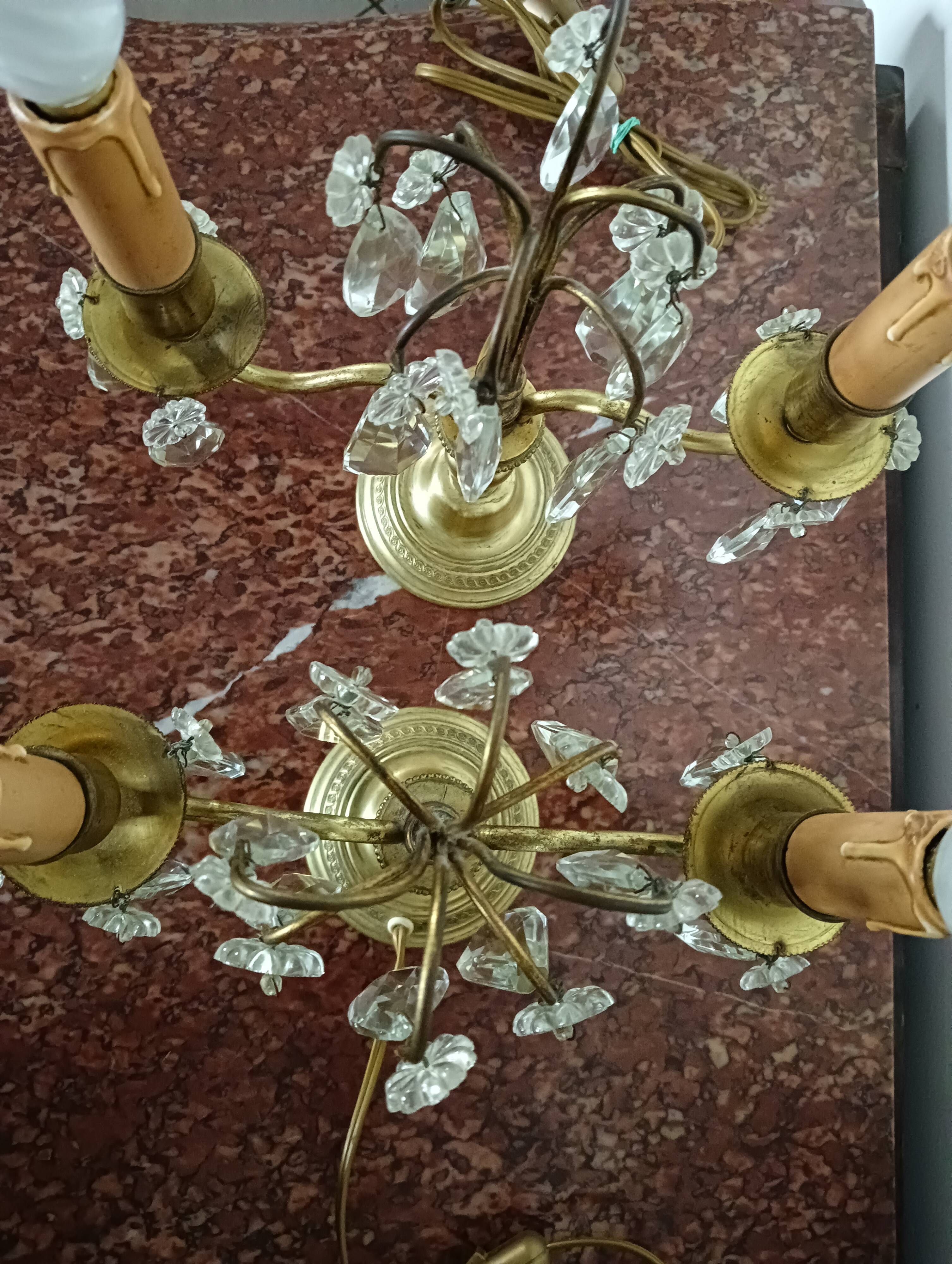 Pair of bronze girandoles with crystal pendants, two arms of lights.