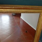 Empire period mirror, early nineteenth in gilded stucco wood H 72 cm