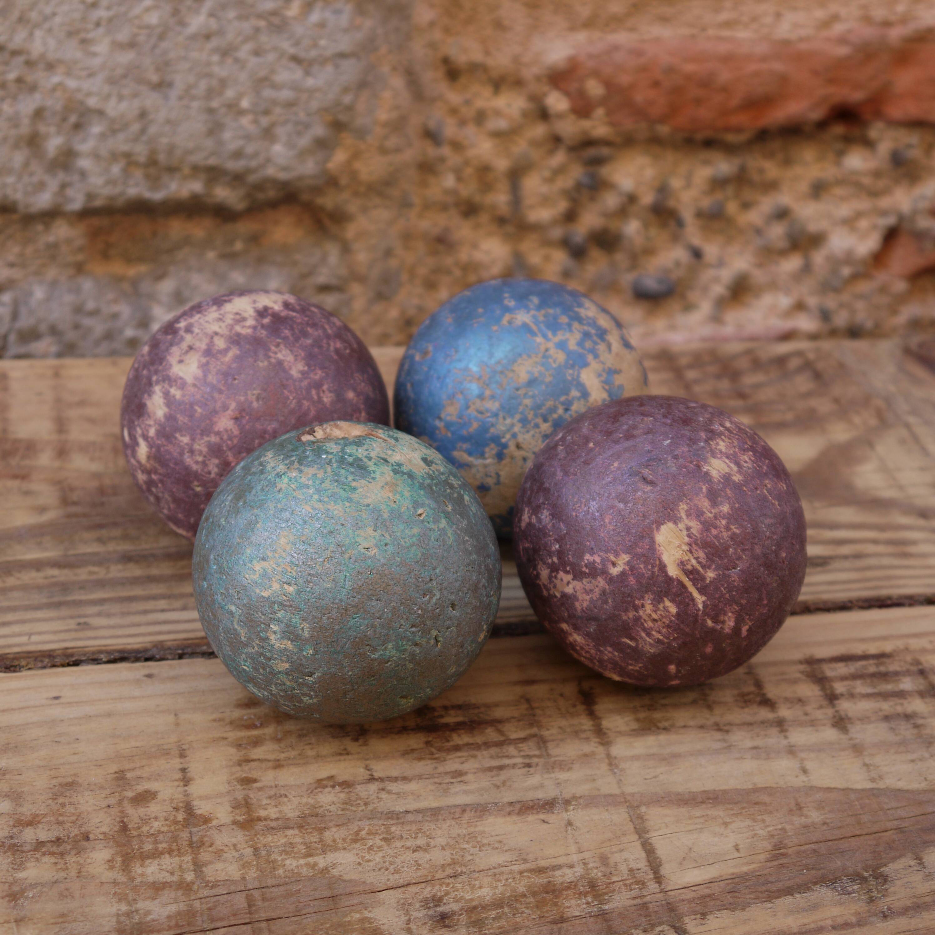 Four bowling balls