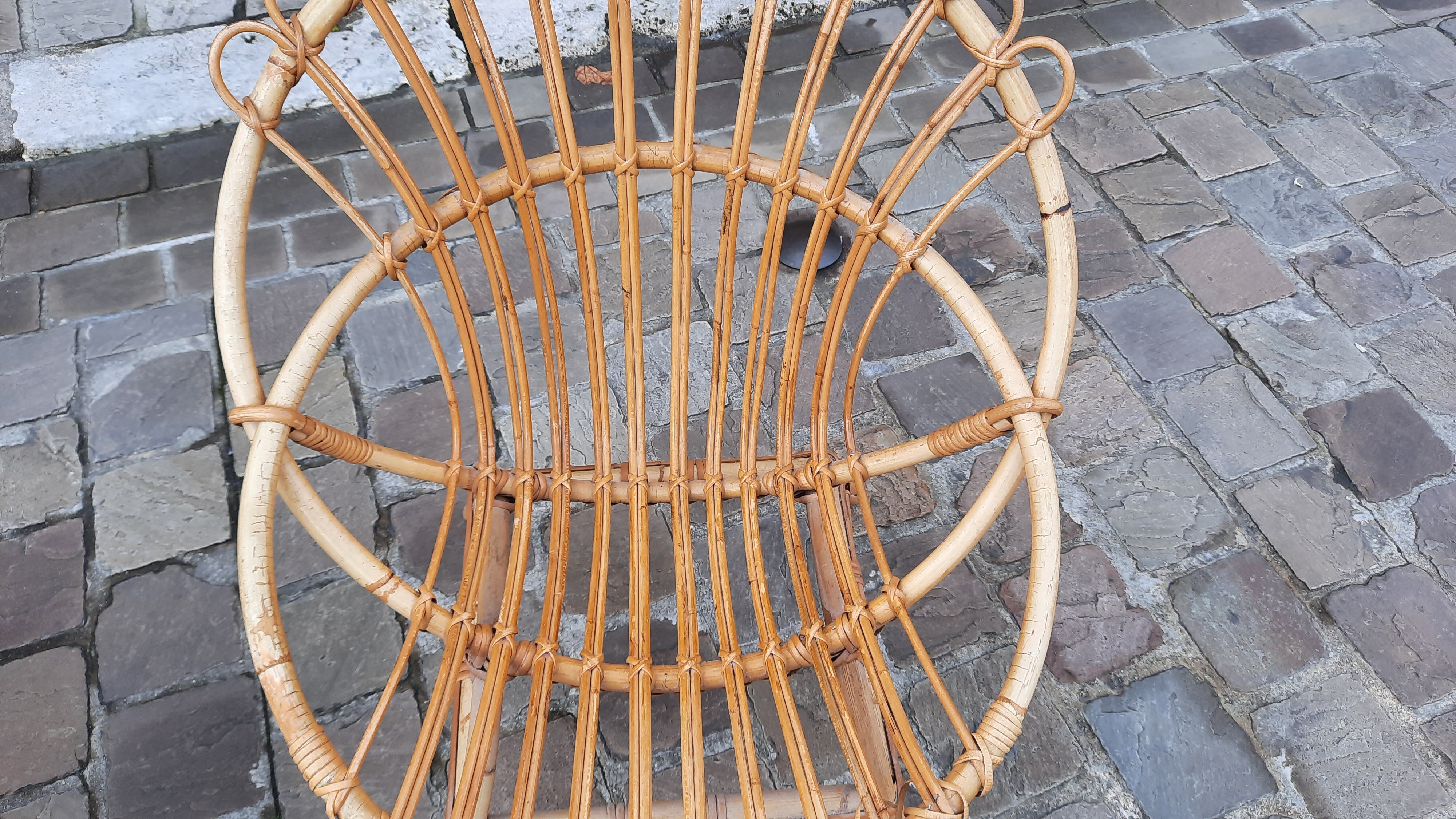 Pairs of shell rattan armchairs from the 50
