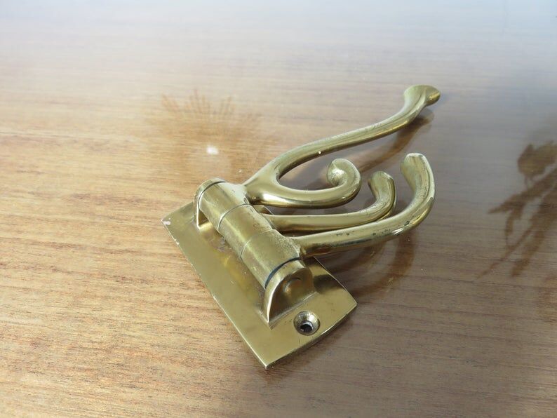 70s brass swivel coat door