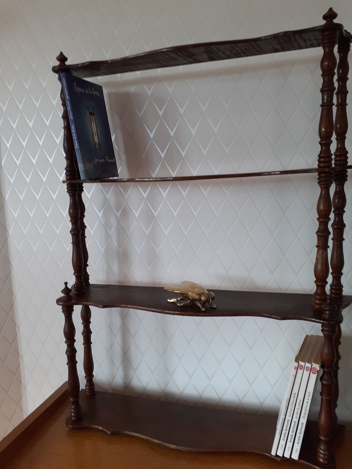 Turned wooden wall shelf