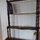Turned wooden wall shelf