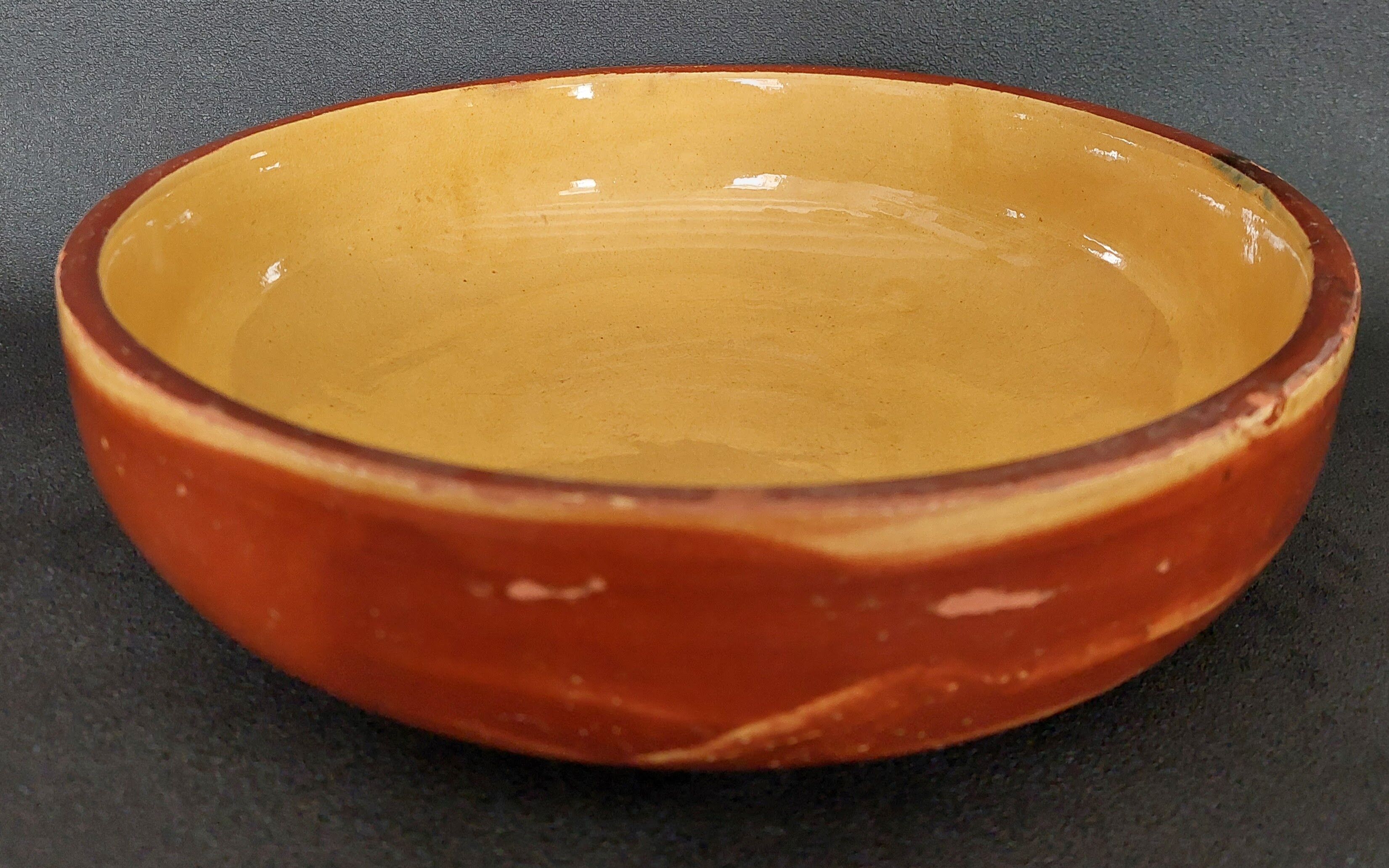 Glazed terracotta shallow dish from the 20th century.