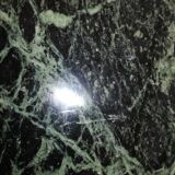 Coffee table in green marble and brass