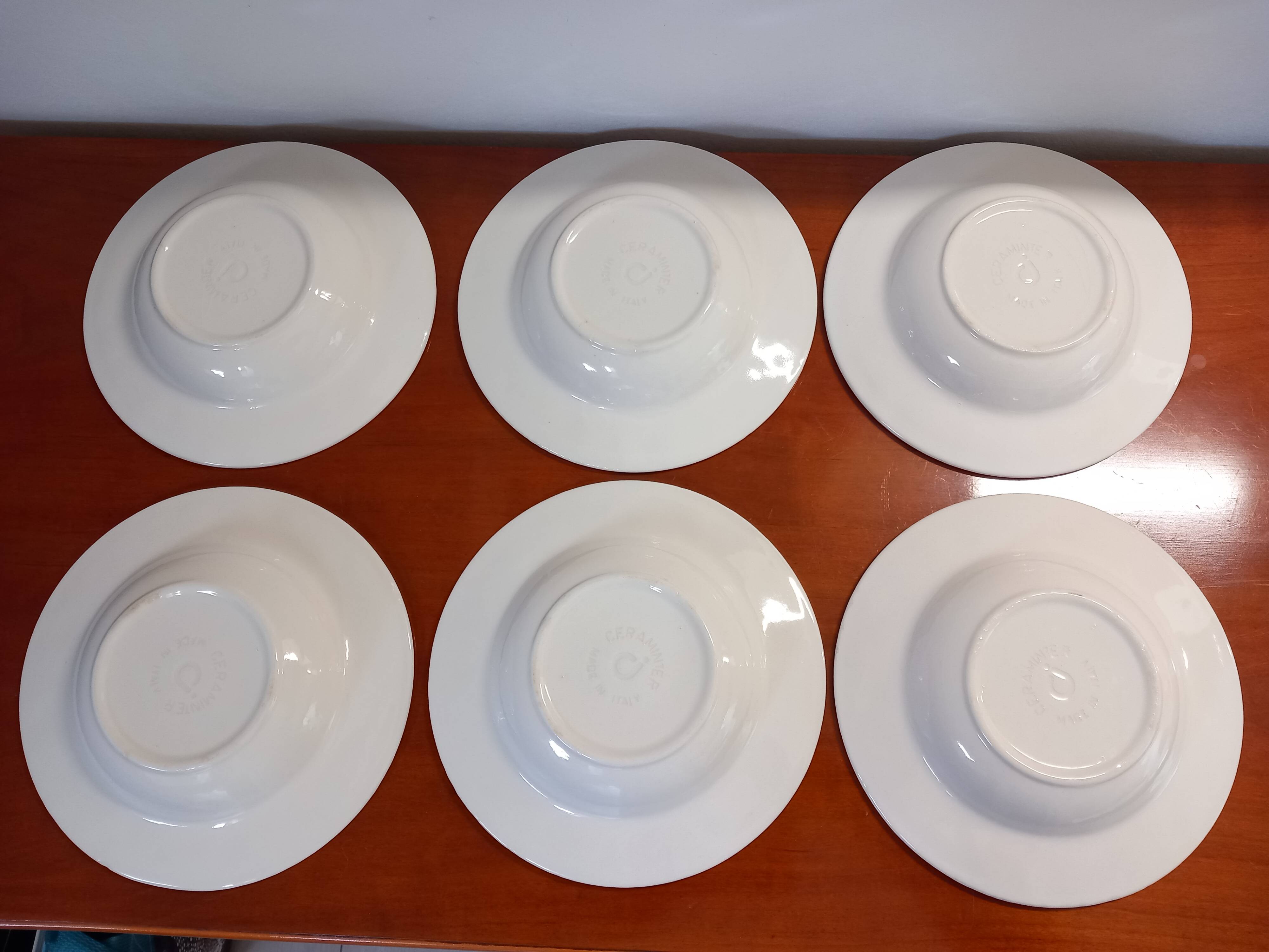 Set of 6 white ceramic deep plates made in Italy.