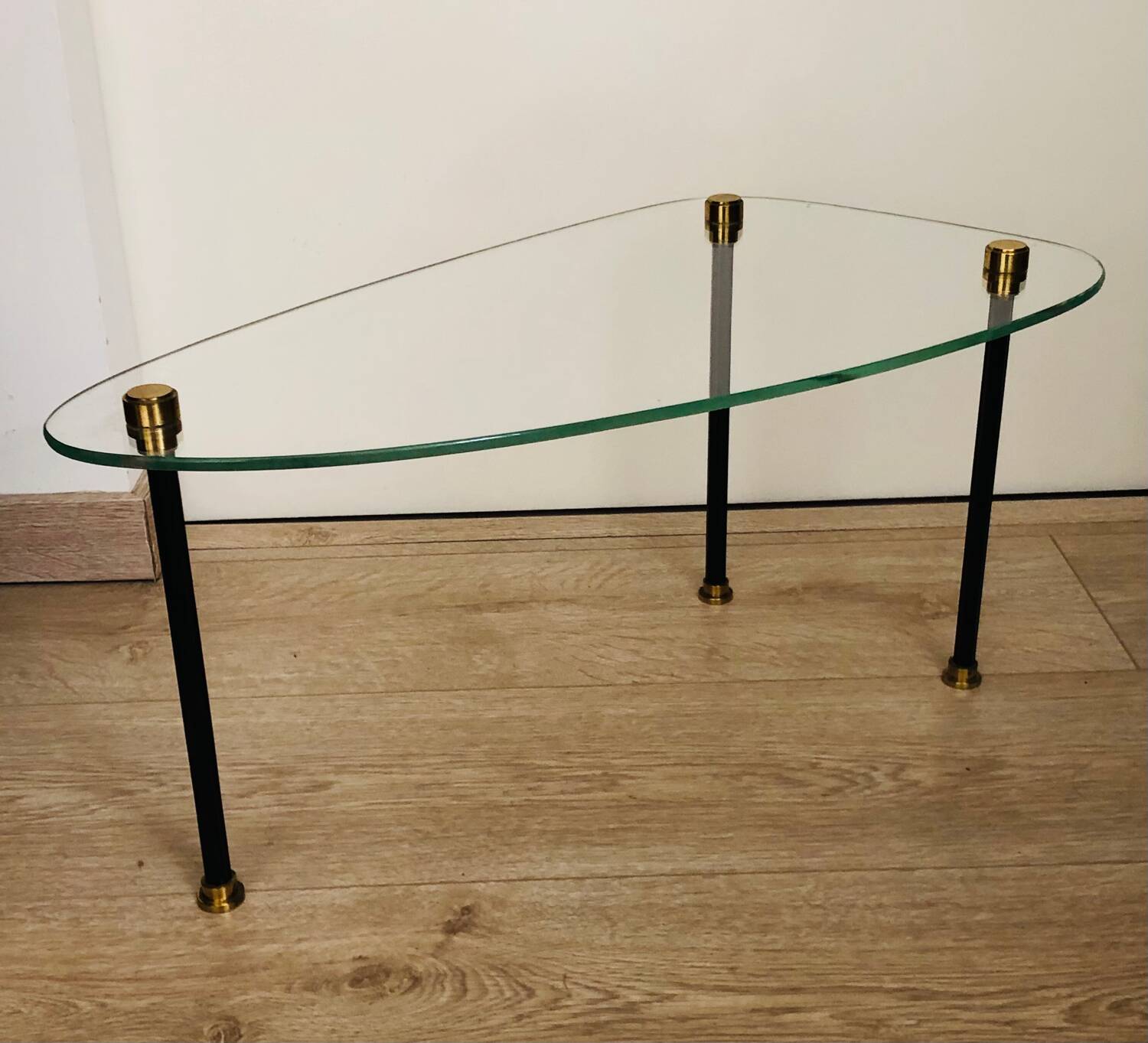 2 small side tables in glass and Bakelite with gold nuts from the 1960s.