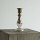 Antique mercury glass candlestick with a patina and silver finish.
