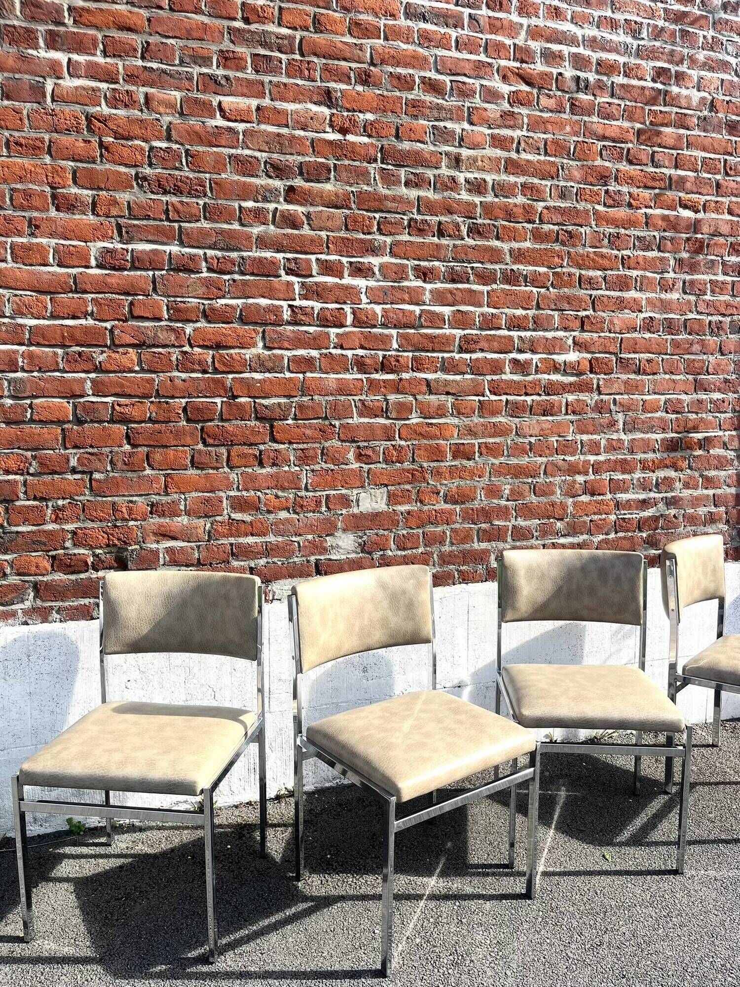 Set of 4 vintage chairs in chrome and faux leather.