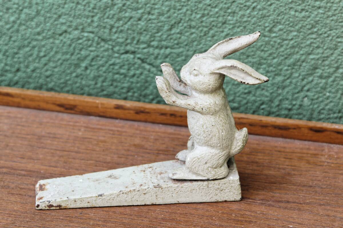 Old cast iron rabbit door wedge
