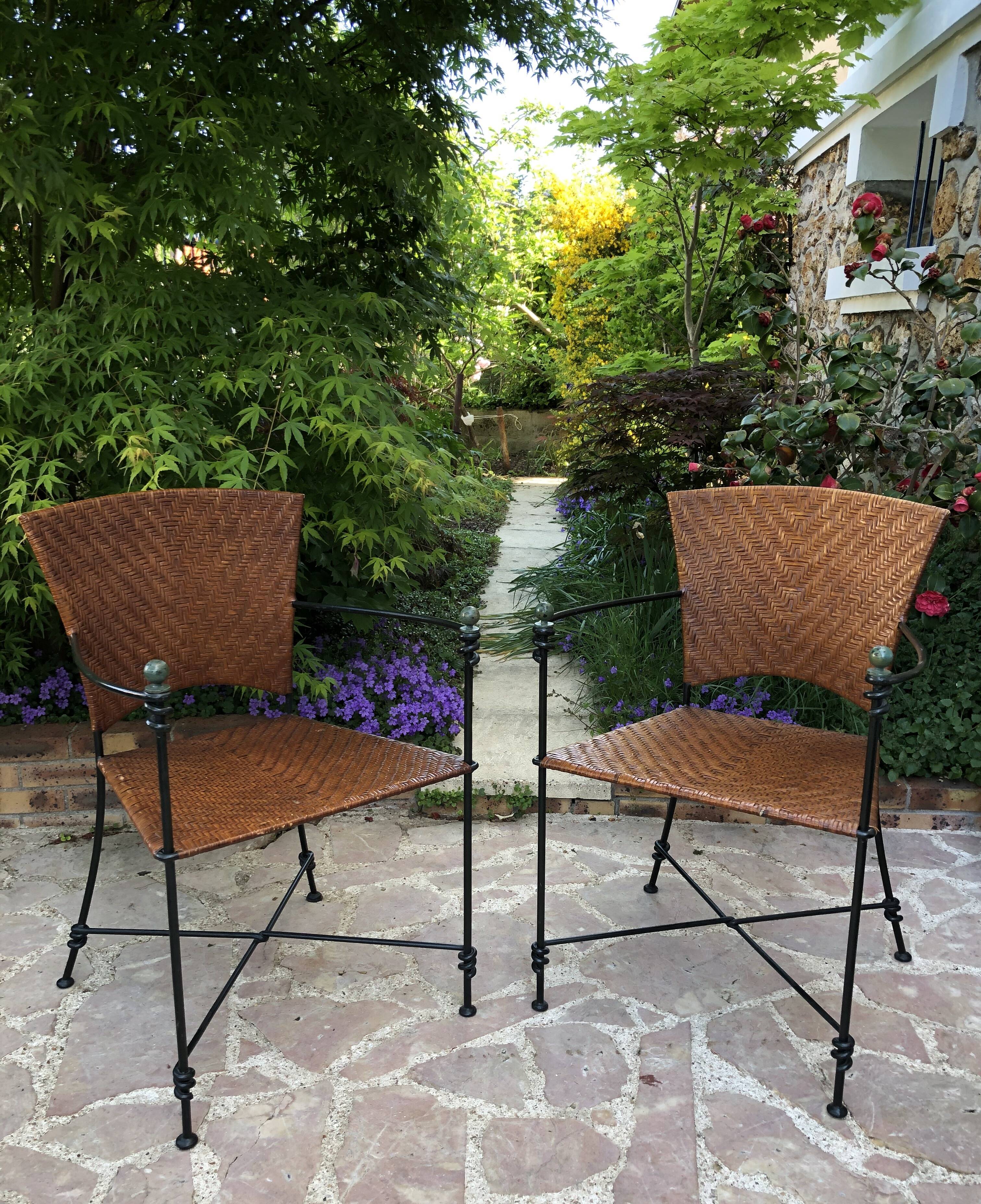 Paire de fauteuils vintage en fer forgé et osier