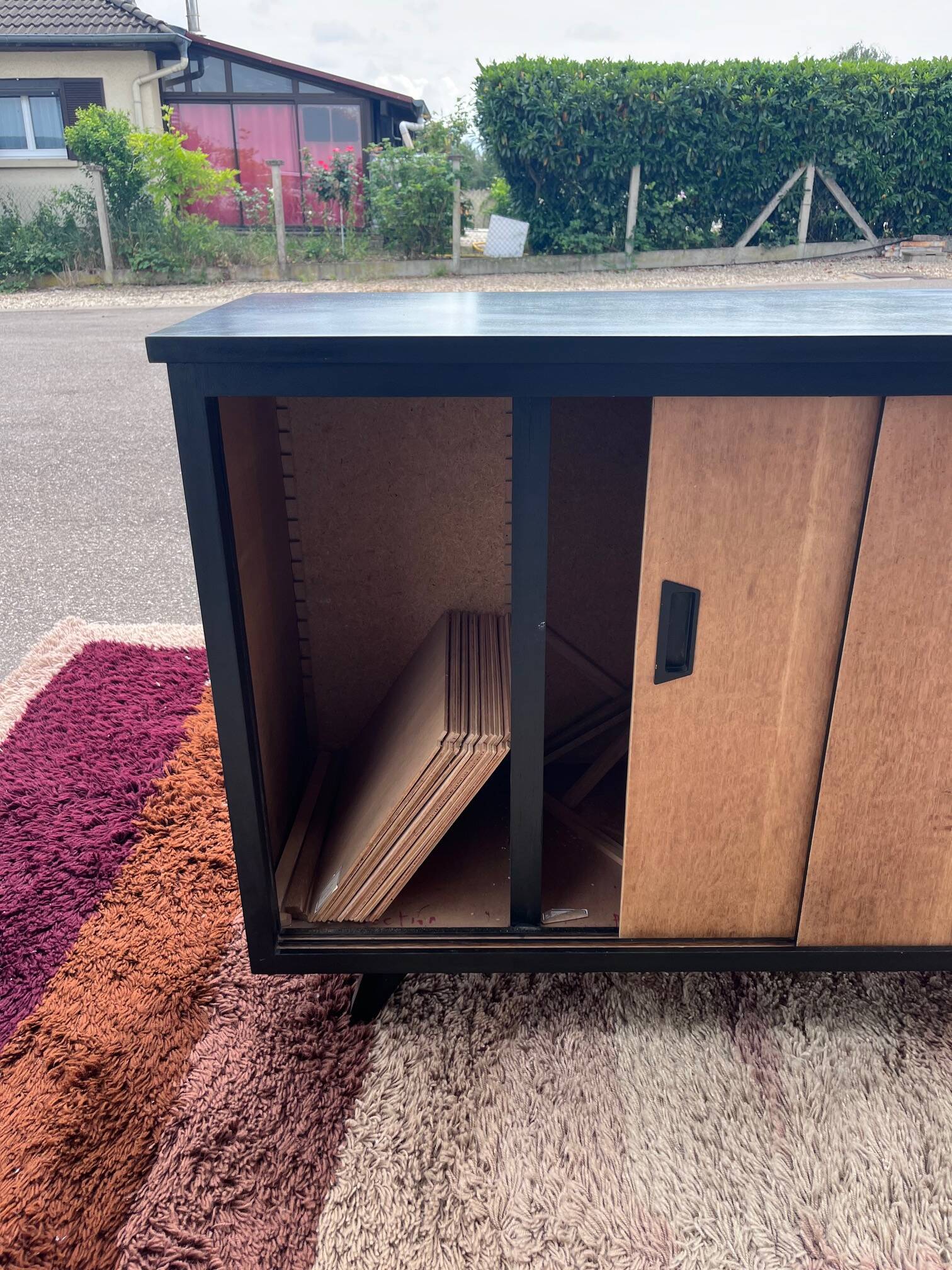 black and wood two-door sideboard