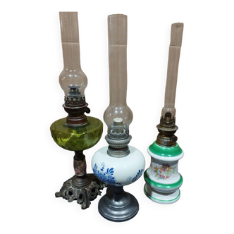 set of three old kerosene lamps