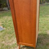 Tall chest of drawers in wood and rattan with splayed legs