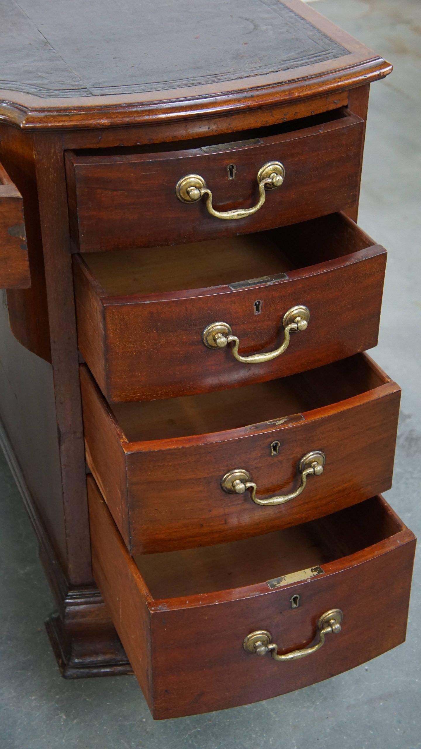 Antique English wooden desk from the late 19th century with a leather top