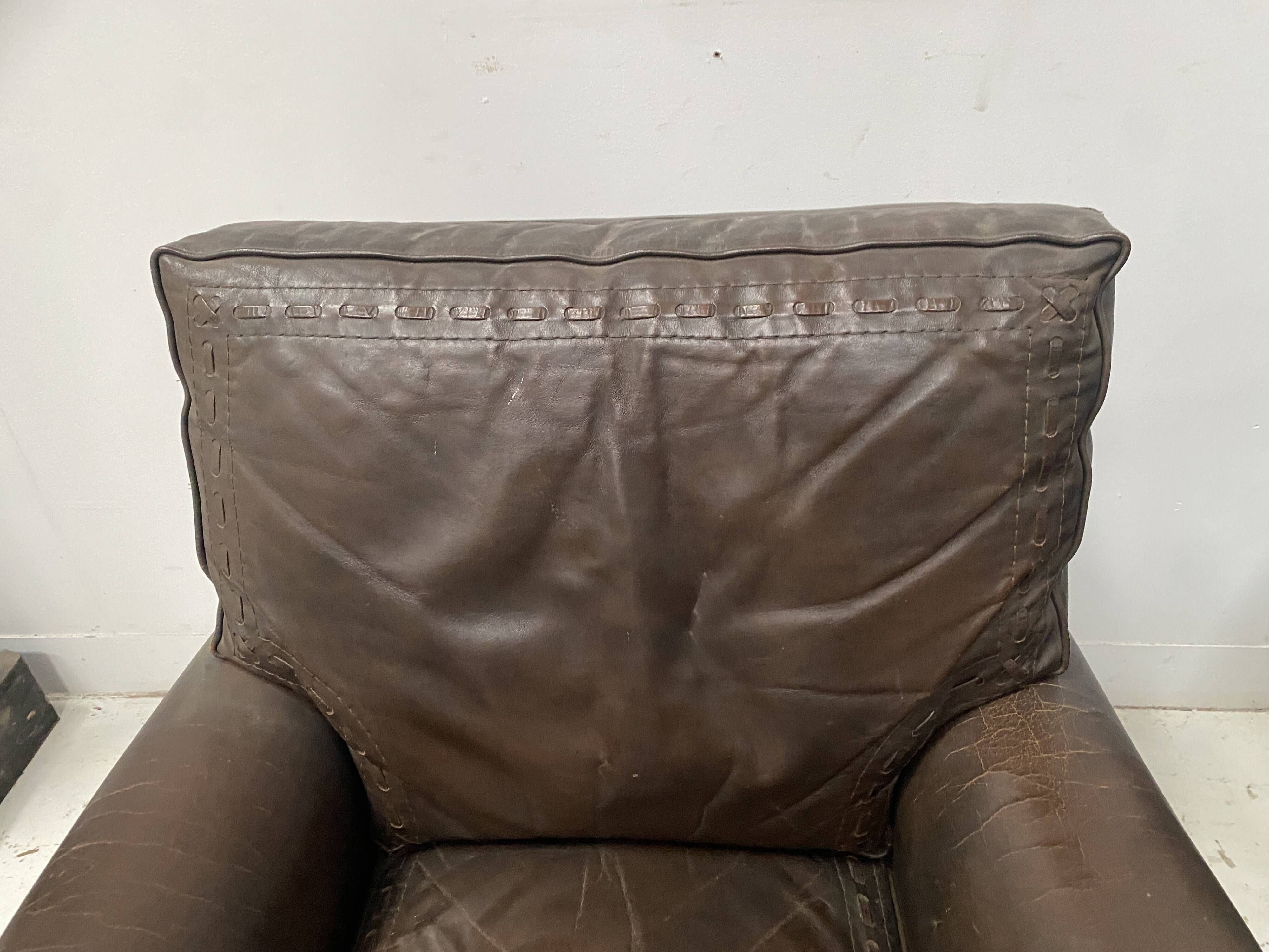 Pair of vintage brown leather armchairs from the 1970s.