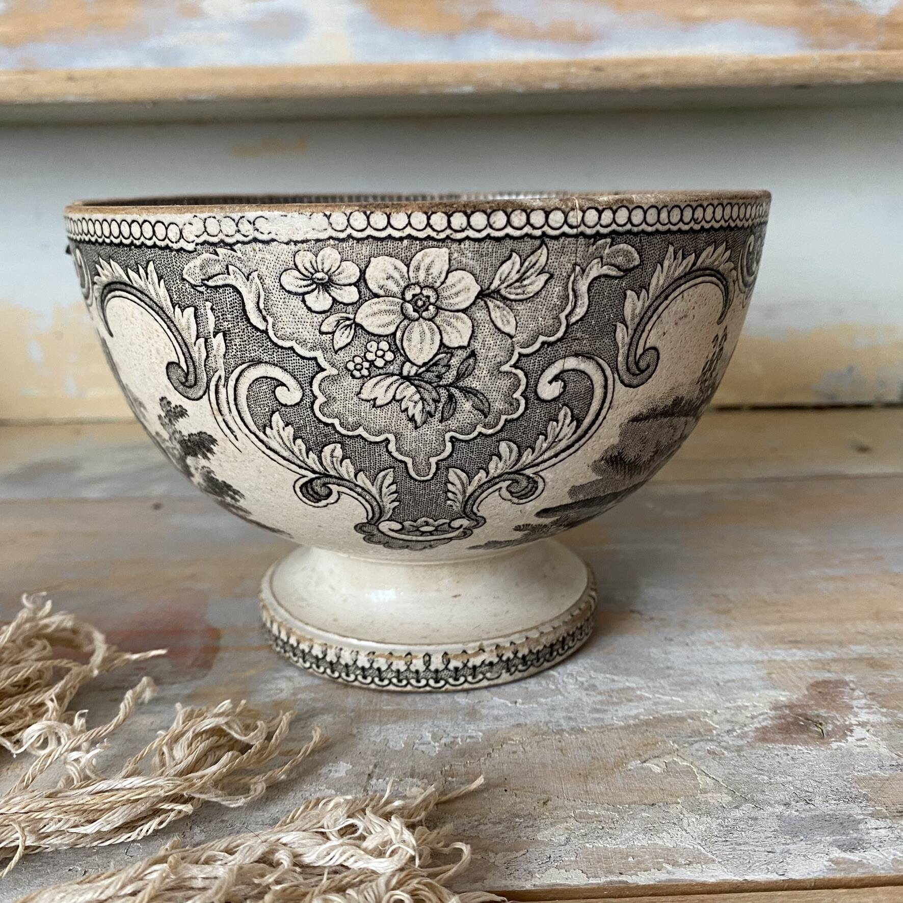 Old bowl made of iron with ceramic seams.