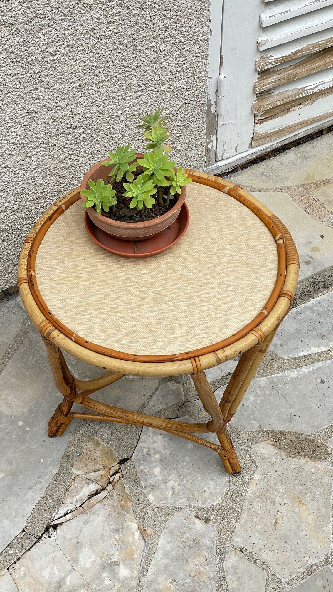 Round coffee table in vintage rattan