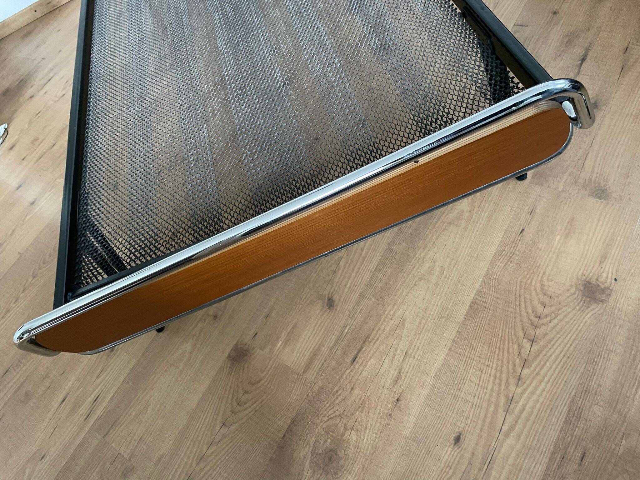 Pair of teak and chrome beds with mattress