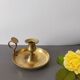 brass candle holder with old cellar rat thumb