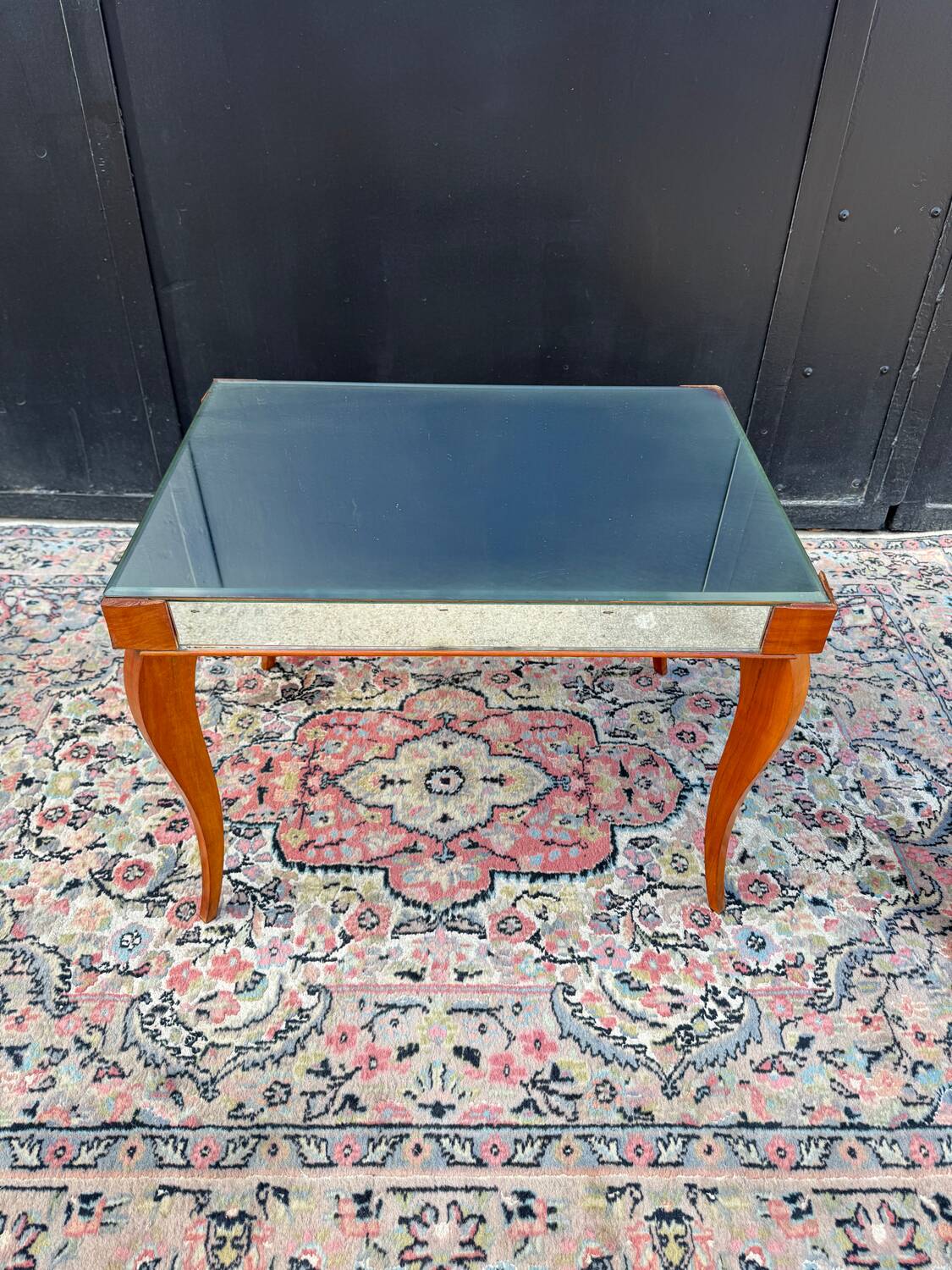 Small wooden coffee table with a mirror from the 1950s.