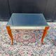 Small wooden coffee table with a mirror from the 1950s.