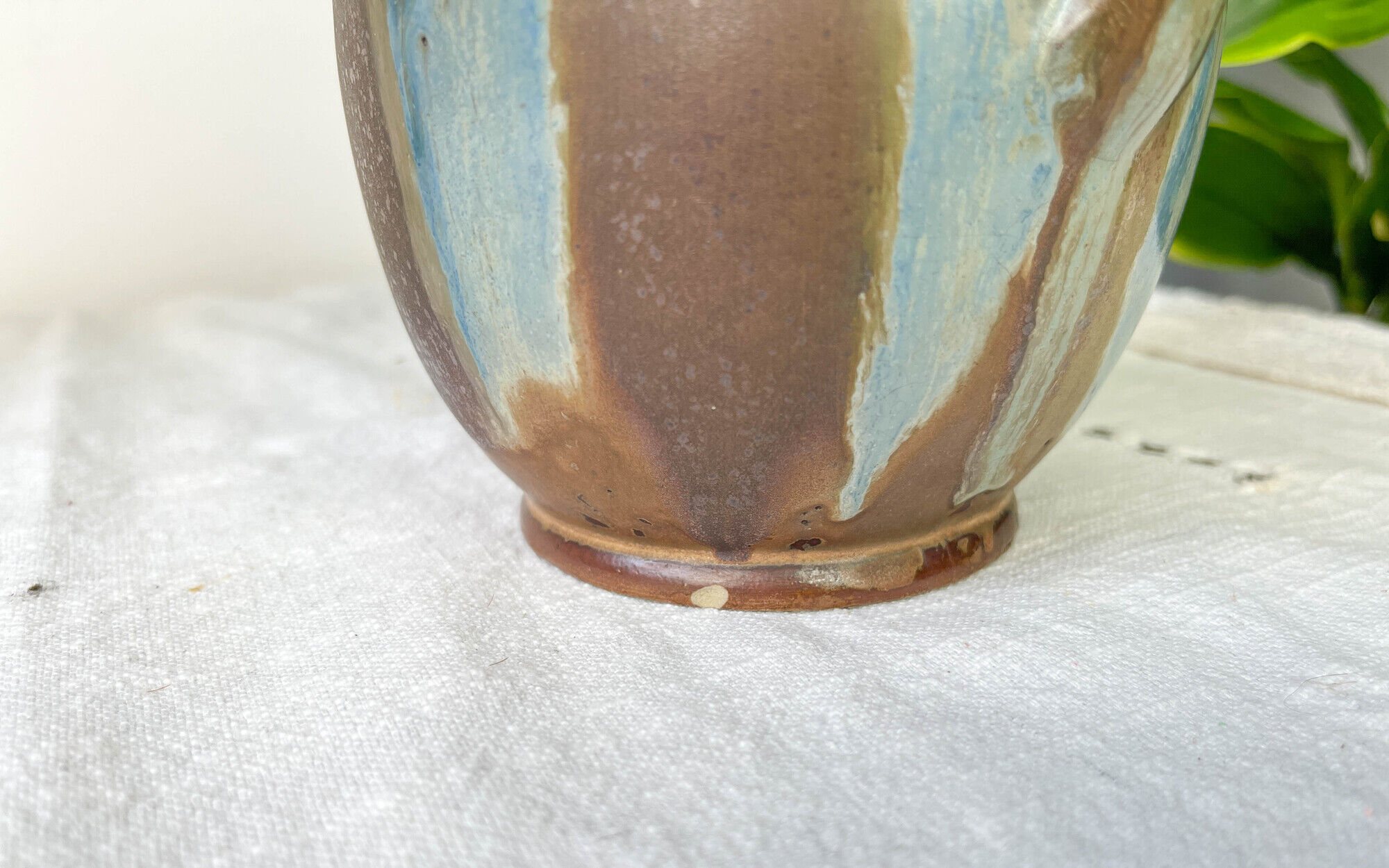 Art Nouveau style carafe in flamed stoneware with blue and brown drips
