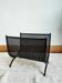Cast iron magazine rack, circa 1950