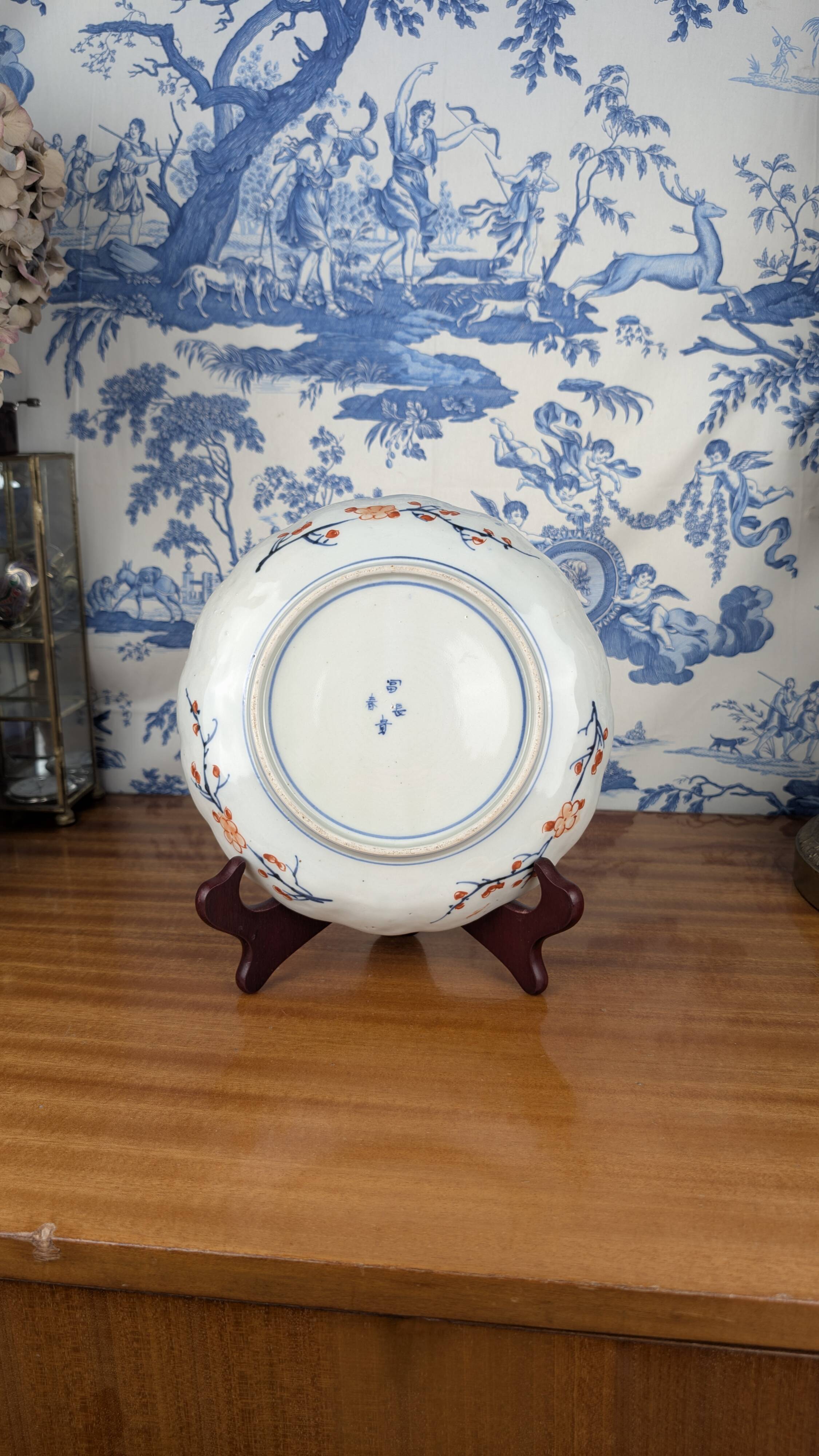 Signed Imari porcelain plate with Japanese lake and deer decoration, 19th century