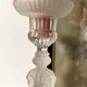 Tall molded glass candle holder with ram heads