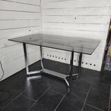 Chromed metal table with smoked glass top