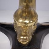 Solid brass dolphin console feet.