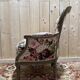 Reupholstered bergère with floral fabric in Louis XVI style.