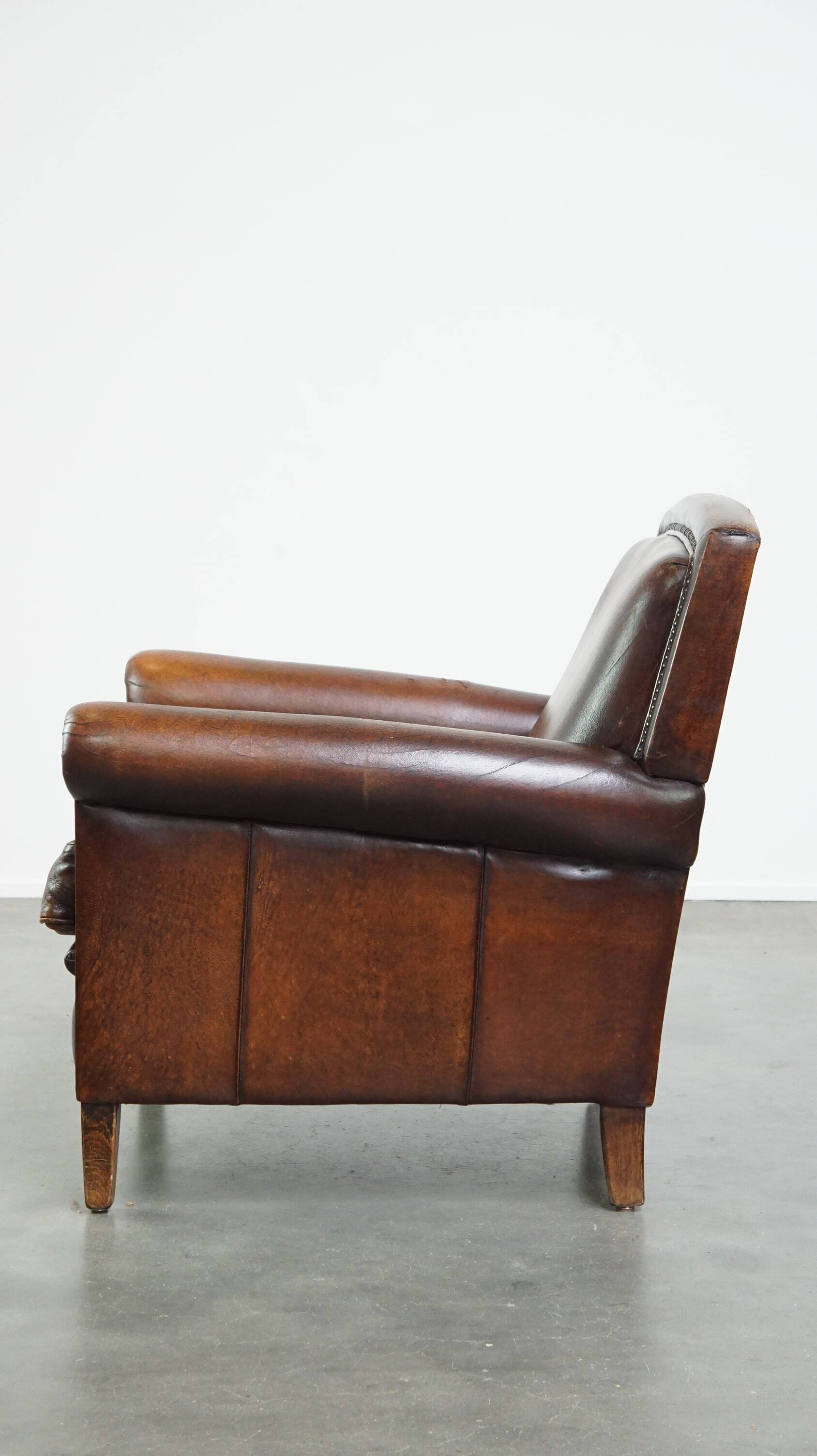 Vintage sheepskin armchair with beautiful warm colors and excellent seating comfort