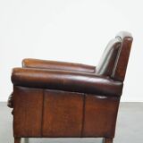 Vintage sheepskin armchair with beautiful warm colors and excellent seating comfort