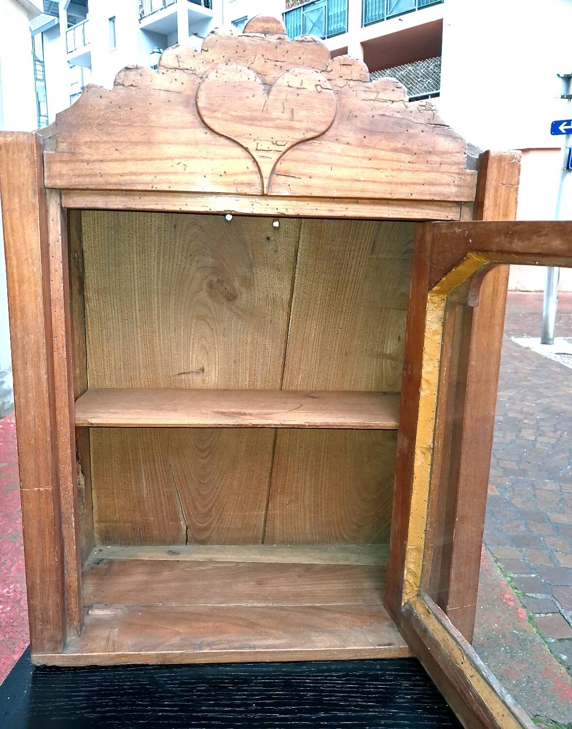 Showcase of popular art in solid wood, carved heart.