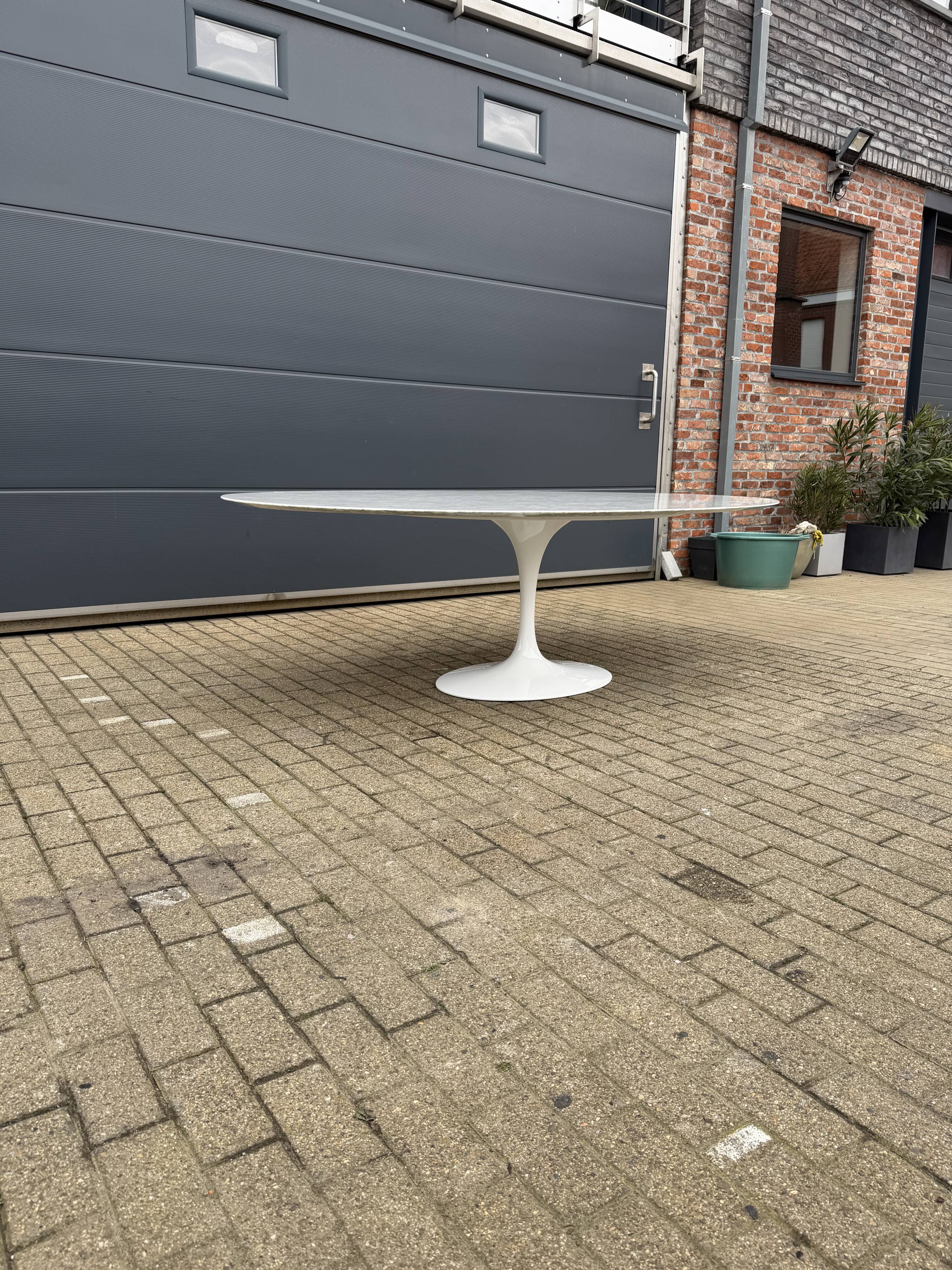 Original Knoll Tulip oval dining table (244cm) in Carrara marble.