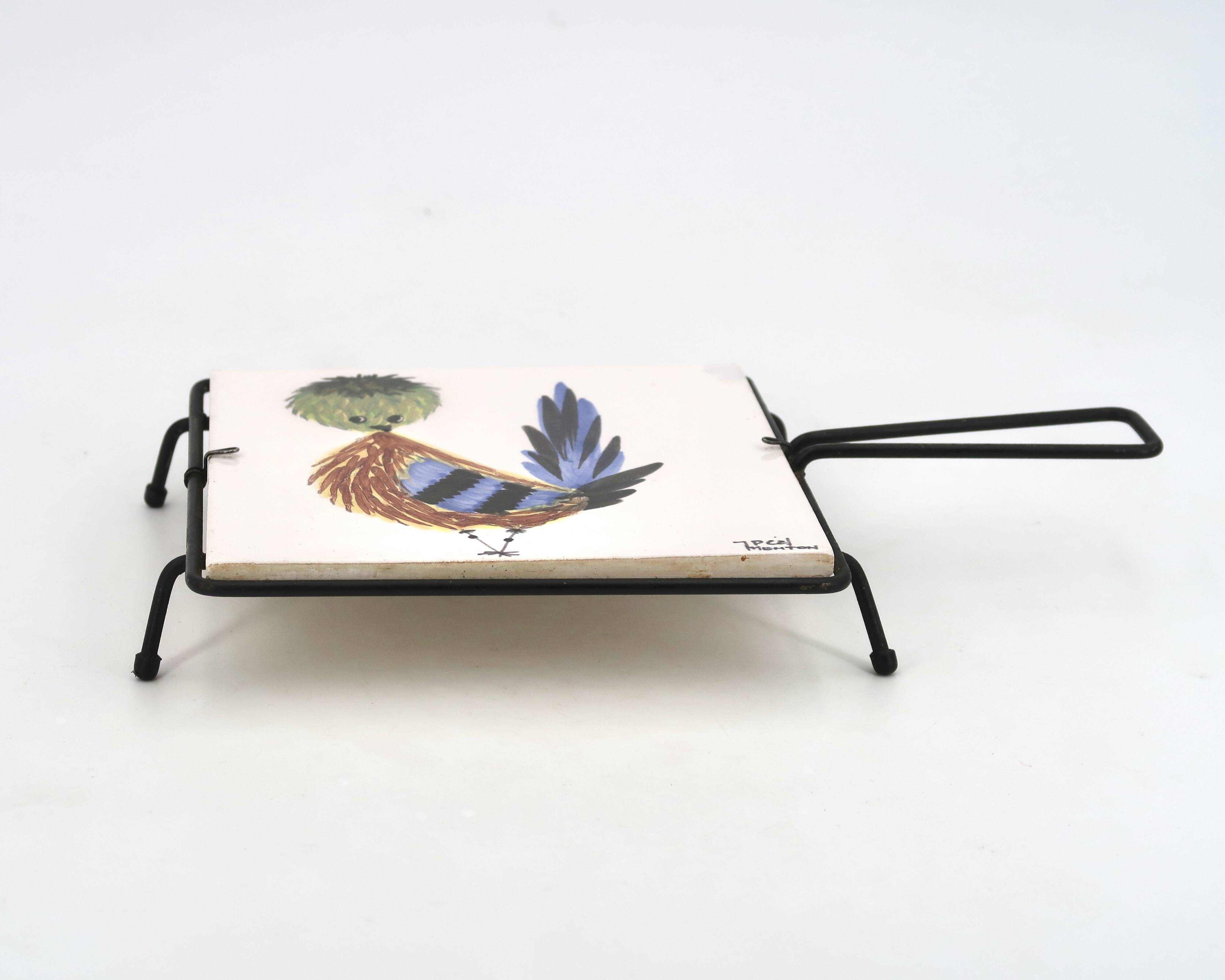 Square ceramic trivet with a bird by Jean Pierre Caffarelli.